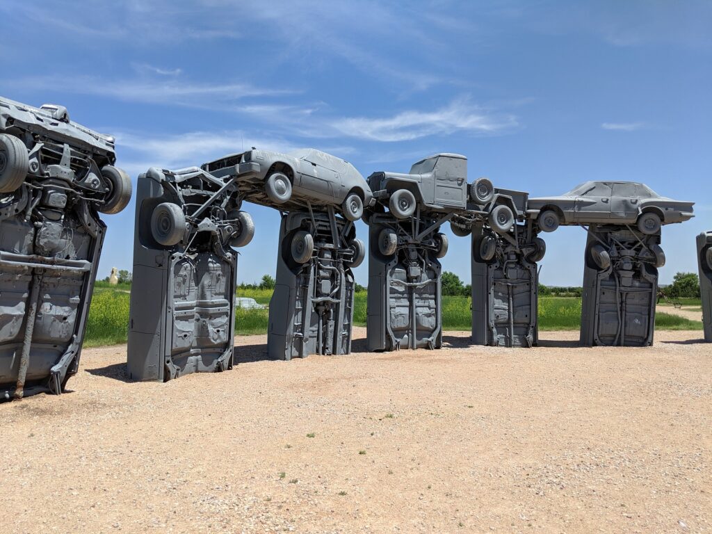 Carhenge is a replica of England's Stonehenge, located in Alliance, Nebraska. It's made up of thirty-eight American cars from the fifties and sixties that have been painted gray and have the same layout and dimensions as Stonehenge. Carhenge was built in 1987 by Jim Reinders and his family as a memorial to his father, who once lived on the farm where Carhenge now stands.